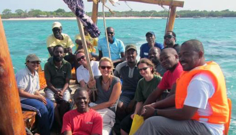 Group photo of workshop participants on the boat after practical reef resilience monitoring