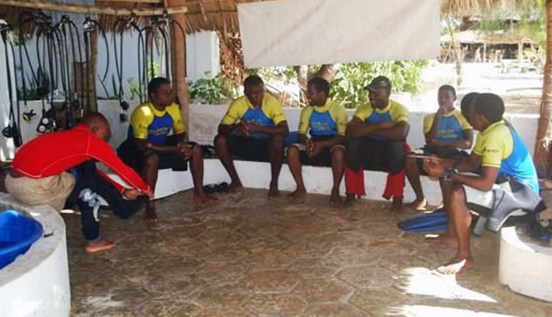 Scuba Do Zanzibar crew being briefed before one of our Crew training dives
