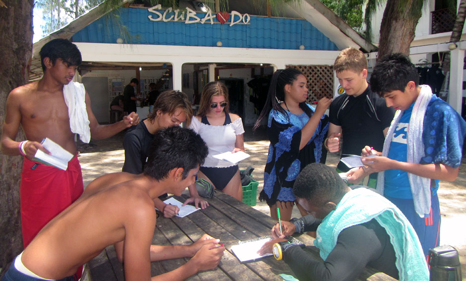 Students identifying fish while logging their dives
